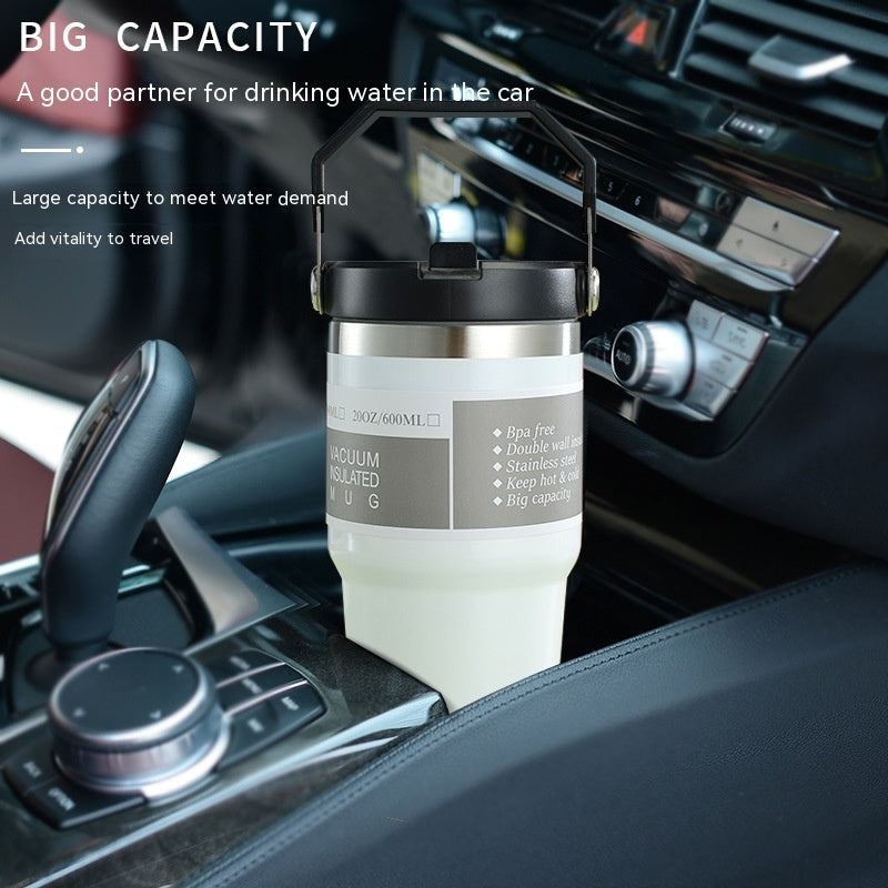Edelstahl Trinkflasche Auto im pinken Design, isolierter Becher mit Griff und Deckel, ideal für unterwegs.